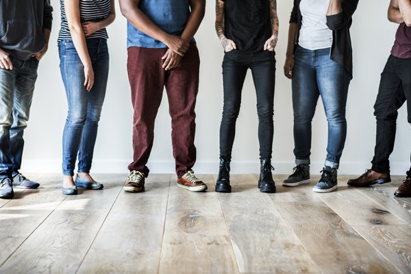 Legs of people standing together