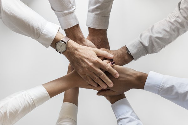 Circle of hands on top of each other